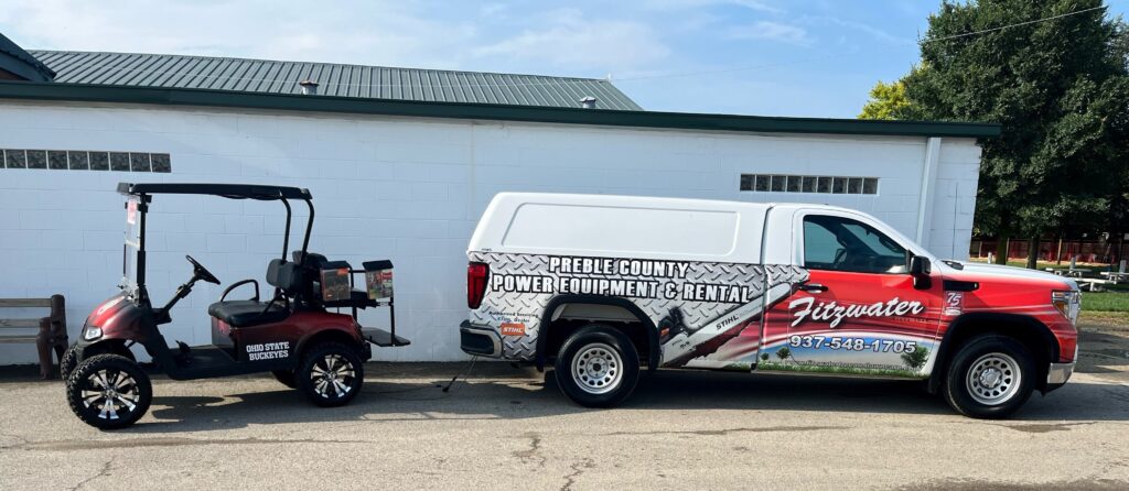 a Fitzwater pickup truck and a golf cart