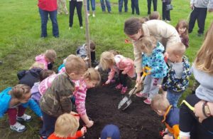 Each year we involve youngsters and our customers to help plant a tree in honor of Arbor Day.
