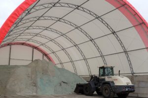 large storage bin with a mound of salt for snow removal